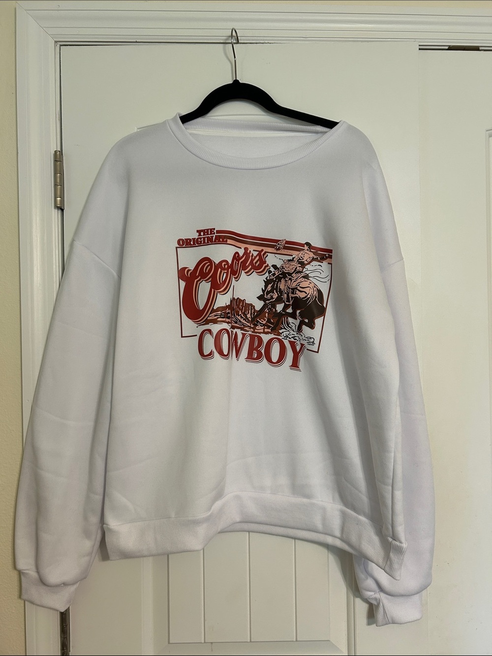 Amazon White Crewneck Sweater with Red Cowboy Graphic